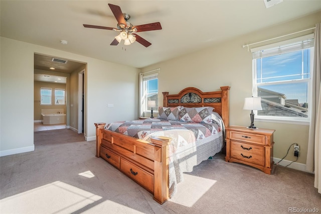 carpeted bedroom with ceiling fan and multiple windows