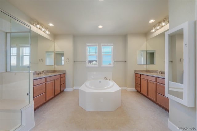 bathroom with vanity, a bath, and tile patterned flooring