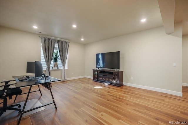 office space with light hardwood / wood-style floors