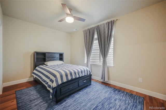 bedroom featuring ceiling fan and dark hardwood / wood-style flooring