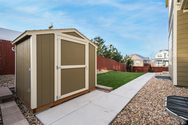 view of outdoor structure featuring a lawn