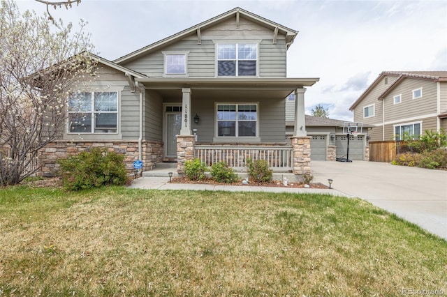 craftsman house with a garage, a front lawn, covered porch, stone siding, and concrete driveway
