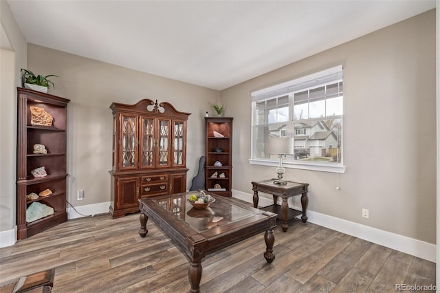 office area featuring baseboards and wood finished floors