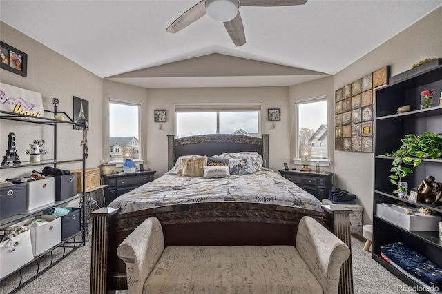 bedroom with a ceiling fan, carpet, and vaulted ceiling