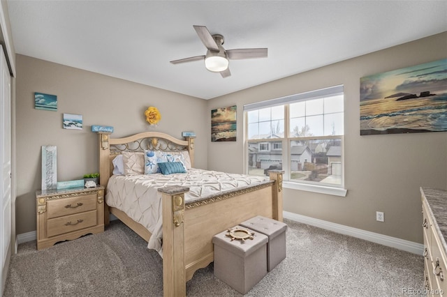 bedroom featuring baseboards, ceiling fan, and light colored carpet