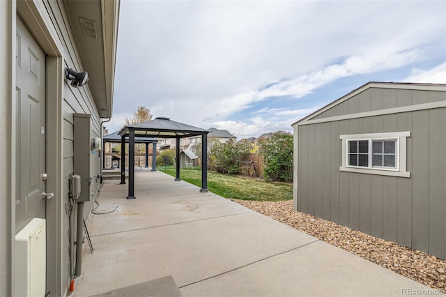 view of patio / terrace with fence and a gazebo