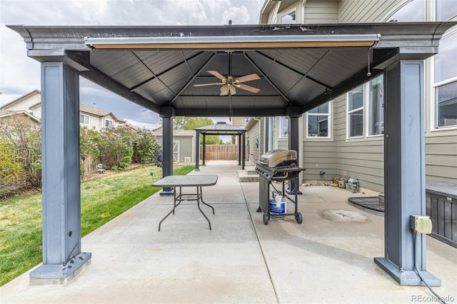 view of patio / terrace featuring a fenced backyard, a gazebo, and grilling area
