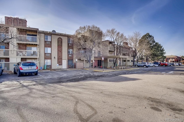 view of property with uncovered parking