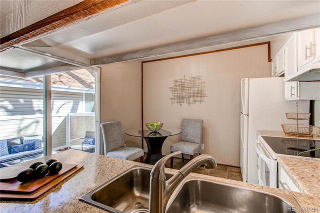 kitchen with sink and electric range