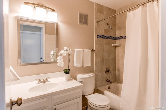 full bathroom featuring vanity, shower / bath combo, and toilet