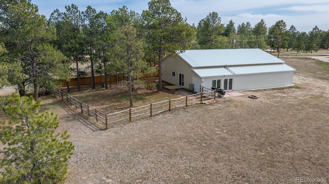 37677 Sable Ridge Rd, Elizabeth, CO 80107 - view of front of house with metal roof, fence, and view of scattered trees