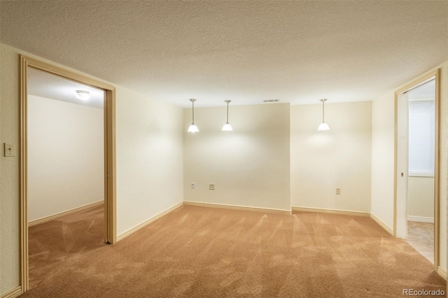 37677 Sable Ridge Rd, Elizabeth, CO 80107 - spare room with light colored carpet, a textured ceiling, and baseboards
