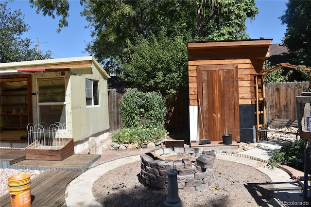 view of outdoor structure with a fire pit