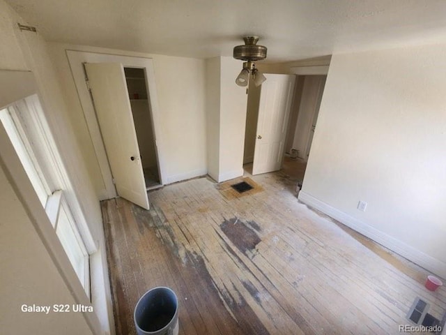 interior space featuring hardwood / wood-style flooring and a closet