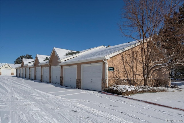 view of snow covered garage