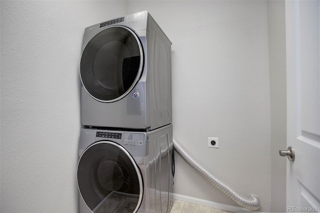 washroom featuring stacked washer and dryer