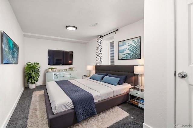 carpeted bedroom with baseboards and visible vents