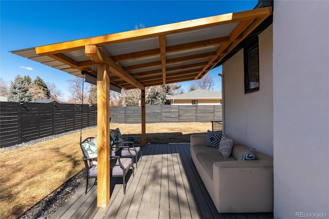 deck with a fenced backyard