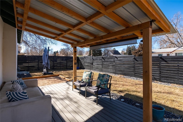 deck with a fenced backyard