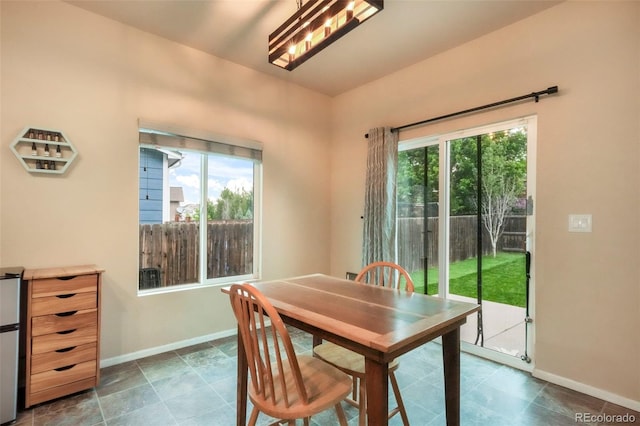 6349 Shooting Iron Way, Colorado Springs, CO 80923 - dining room featuring healthy amount of natural light