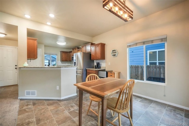 6349 Shooting Iron Way, Colorado Springs, CO 80923 - dining room featuring recessed lighting and stone finish floors