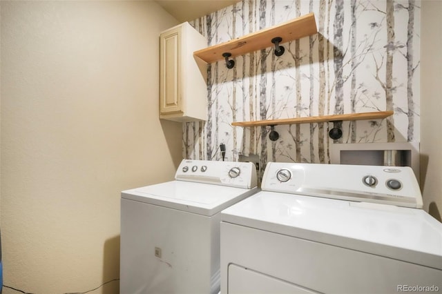 6349 Shooting Iron Way, Colorado Springs, CO 80923 - laundry room with cabinet space and washing machine and clothes dryer