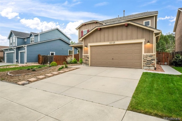 6349 Shooting Iron Way, Colorado Springs, CO 80923 - craftsman-style home with board and batten siding, stone siding, concrete driveway, and an attached garage