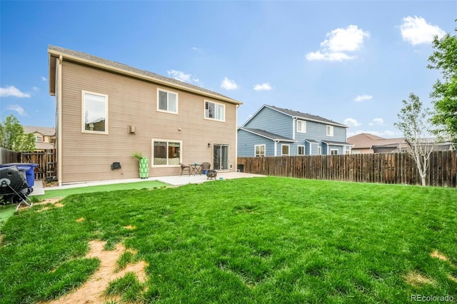 6349 Shooting Iron Way, Colorado Springs, CO 80923 - rear view of property featuring a patio area and a fenced backyard