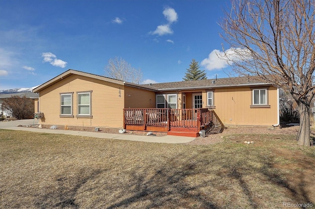 view of front of house featuring a deck with mountain view