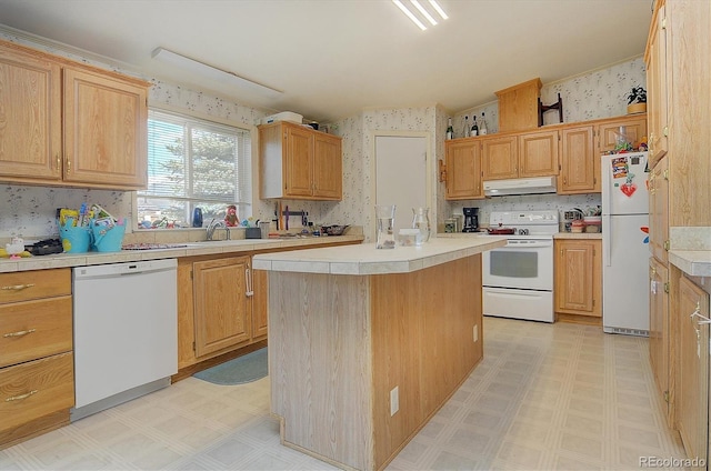 kitchen featuring a center island and white appliances