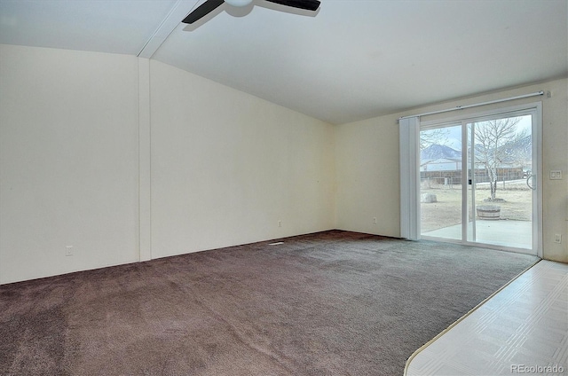 empty room with carpet, ceiling fan, and lofted ceiling