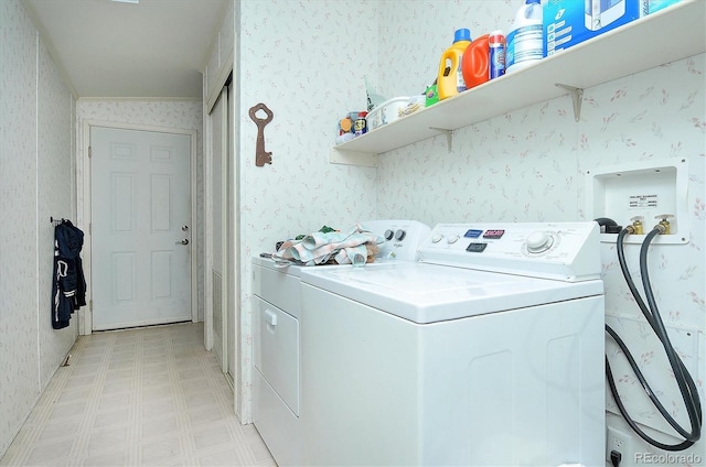 laundry room with washer and dryer and ornamental molding