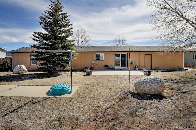 back of property with a patio area