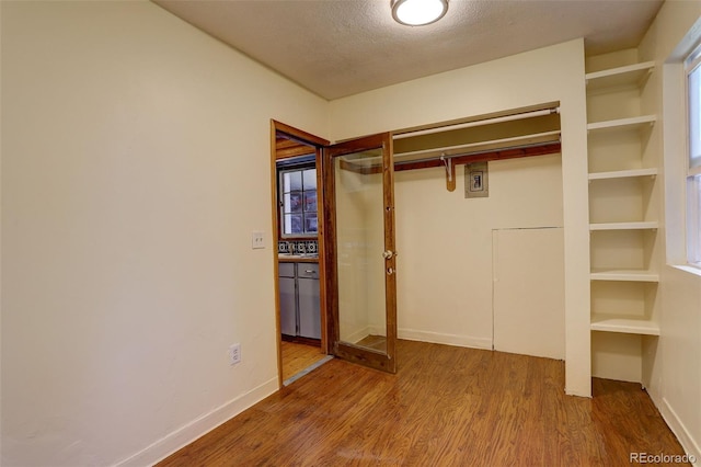 184 Signal Rock Rd, Golden, CO 80403 - unfurnished bedroom featuring wood finished floors, a closet, and a textured ceiling