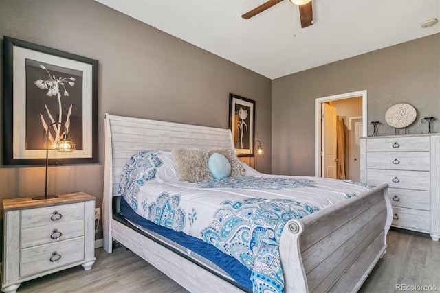 bedroom featuring ceiling fan and wood-type flooring