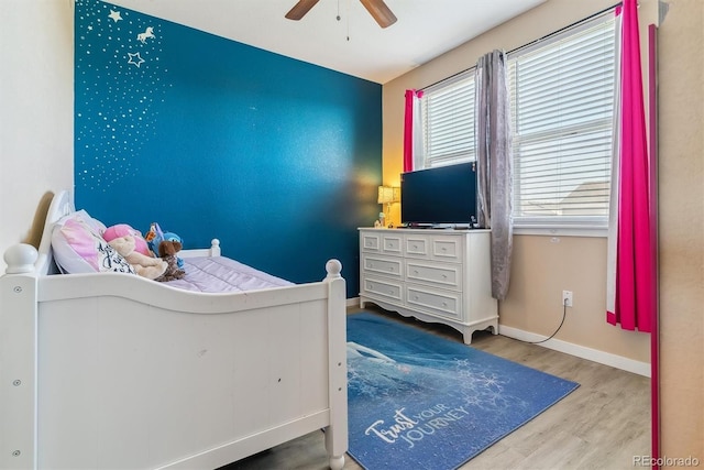 bedroom featuring light hardwood / wood-style flooring and ceiling fan