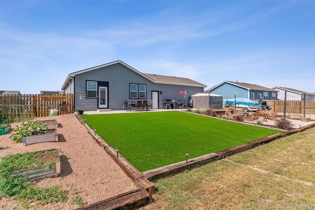 rear view of property with a patio area and a yard