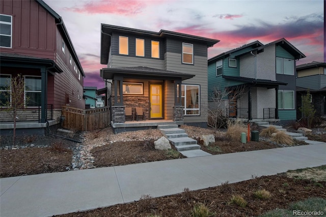 6052 N Malta St, Aurora, CO 80019 - contemporary home with a porch and stone siding