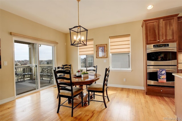 15004 Verbena St, Thornton, CO 80602 - dining room with recessed lighting, light wood-type flooring, baseboards, and an inviting chandelier