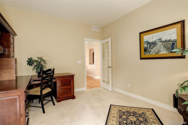 15004 Verbena St, Thornton, CO 80602 - home office with carpet, baseboards, visible vents, arched walkways, and french doors