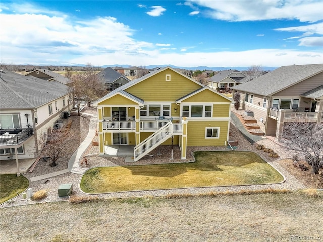 15004 Verbena St, Thornton, CO 80602 - view of front of property featuring stairway, a residential view, and a front lawn