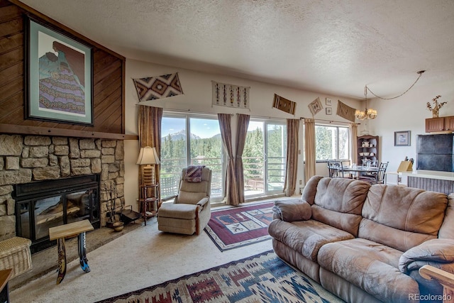 9800 Ryan Gulch Rd Unit A-101, Silverthorne, CO 80498 - carpeted living room featuring a textured ceiling, a chandelier, and a fireplace