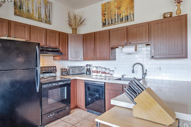 9800 Ryan Gulch Rd Unit A-101, Silverthorne, CO 80498 - kitchen with black appliances, under cabinet range hood, light countertops, light tile patterned floors, and decorative backsplash