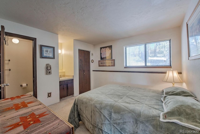 9800 Ryan Gulch Rd Unit A-101, Silverthorne, CO 80498 - bedroom with light colored carpet and a textured ceiling