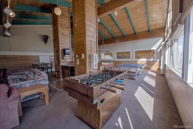 9800 Ryan Gulch Rd Unit A-101, Silverthorne, CO 80498 - rec room featuring a wooden ceiling with exposed beams, high vaulted ceiling, carpet flooring, and wooden walls