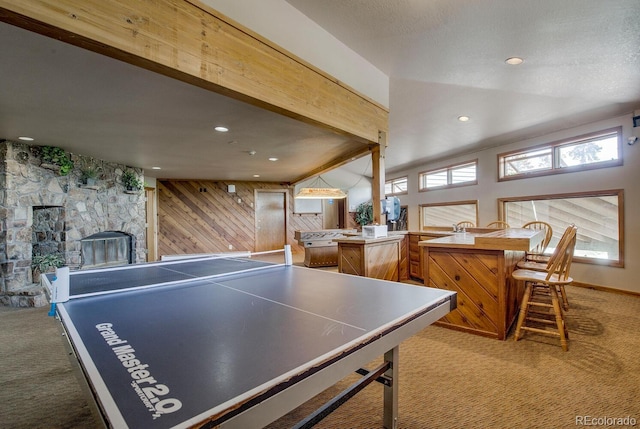 9800 Ryan Gulch Rd Unit A-101, Silverthorne, CO 80498 - rec room featuring carpet floors, wood walls, a fireplace, recessed lighting, and beam ceiling