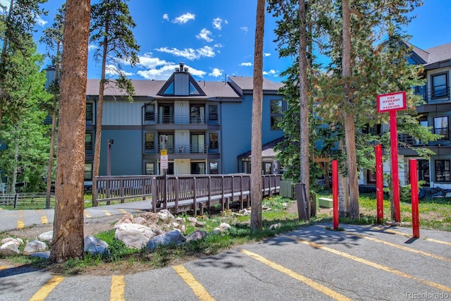 9800 Ryan Gulch Rd Unit A-101, Silverthorne, CO 80498 - view of building exterior featuring uncovered parking