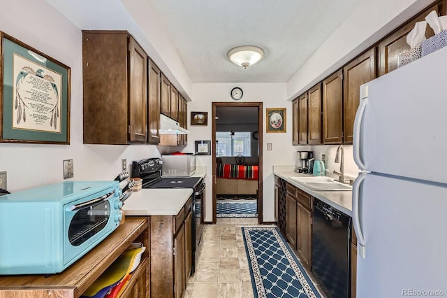 6330 E Wesley Ave, Denver, CO 80222 - kitchen featuring black appliances, a sink, under cabinet range hood, light countertops, and dark brown cabinets
