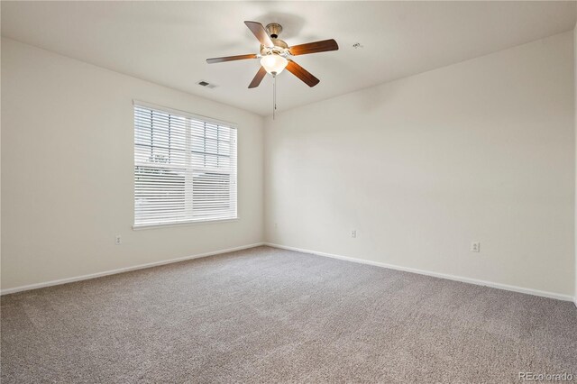 9907 Martin Luther King Blvd Unit 103, Denver, CO 80238 - carpeted spare room with baseboards and a ceiling fan