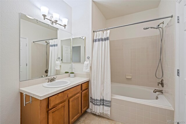 9907 Martin Luther King Blvd Unit 103, Denver, CO 80238 - bathroom with tiled shower / bath combo, vanity, and tile patterned flooring